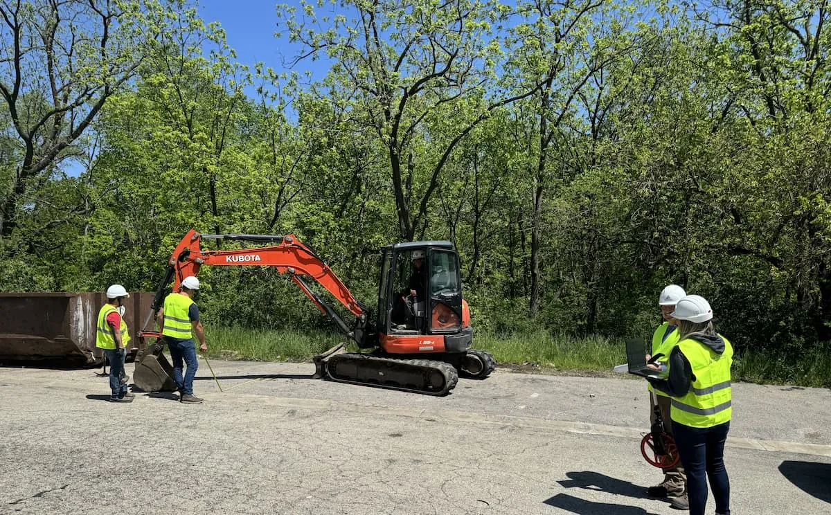 Watch Hill crew working alongside a Kubota excavator on site