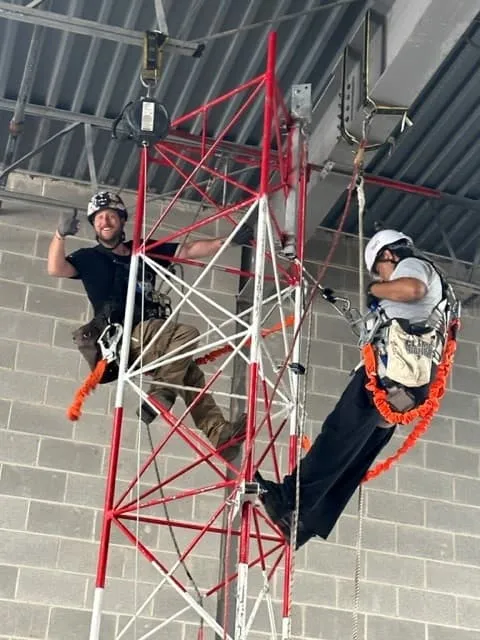 Technicians training on a rescue tower