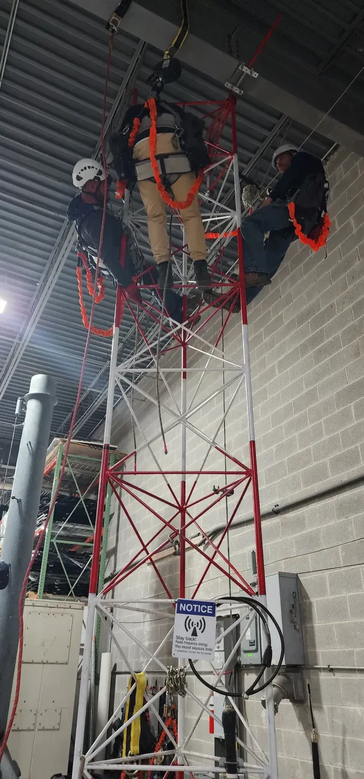 Watch Hill technicians training on a rescue tower