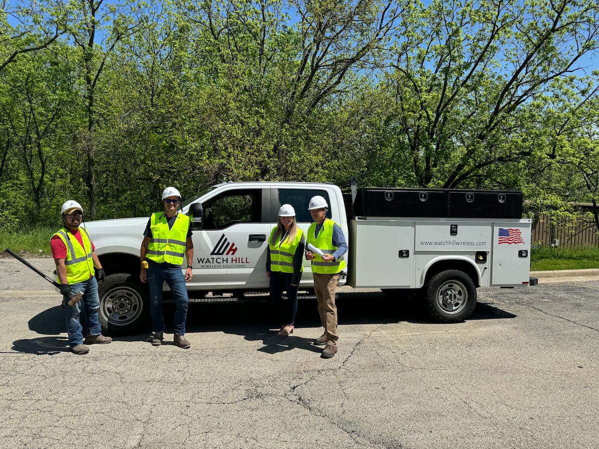 Watch Hill construction crew beside a company utility truck