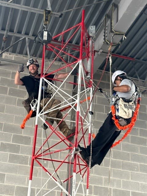 Technicians training on a rescue tower
