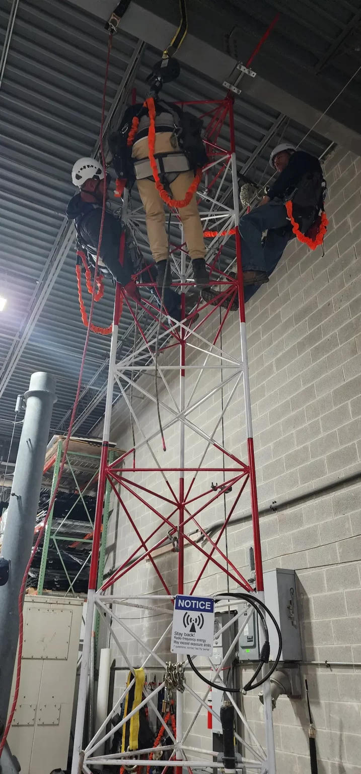 Watch Hill technicians training on a rescue tower